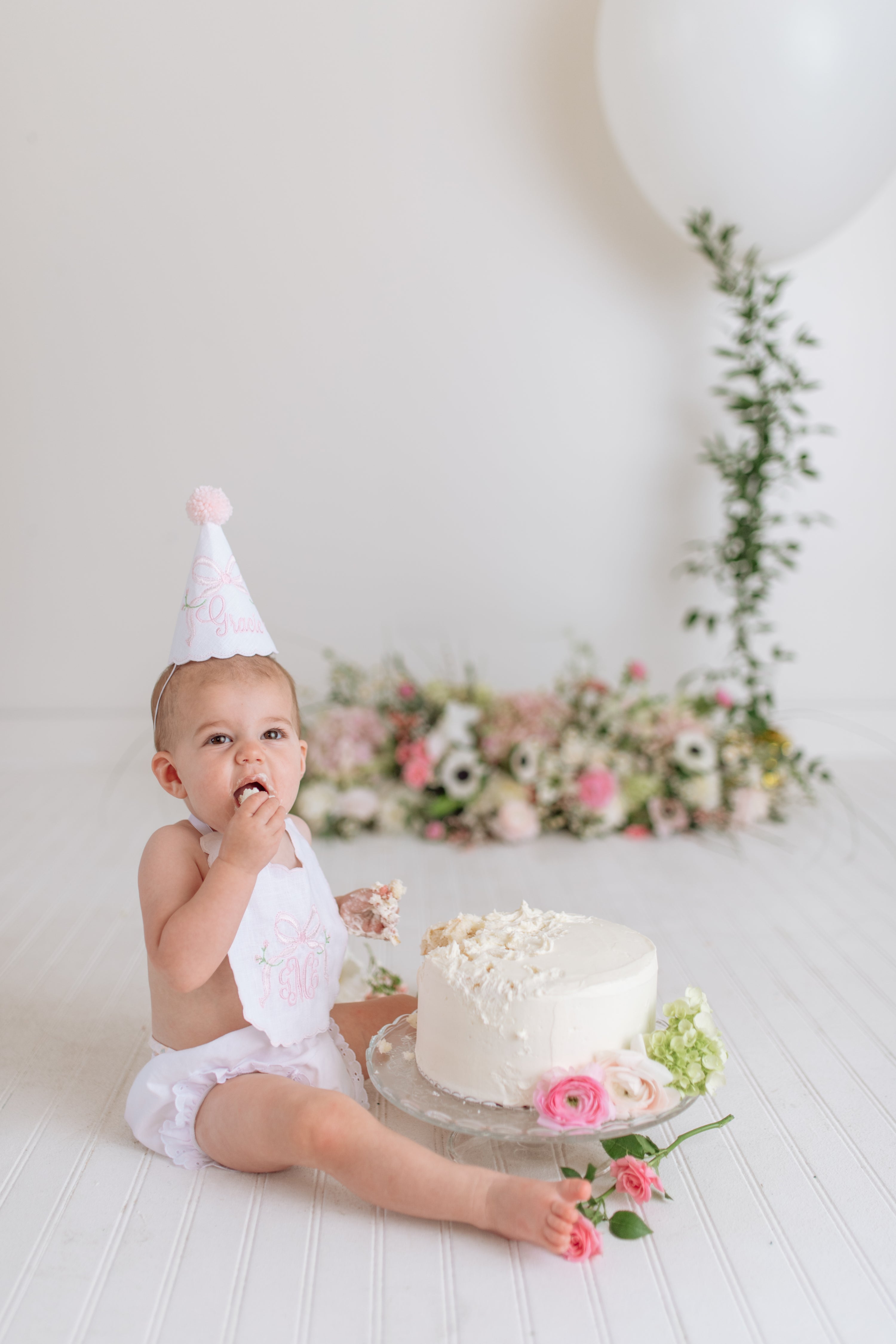 Blush birthday girl party sets featuring heirloom flowers and bows